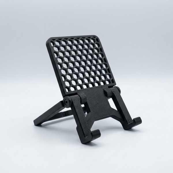 3D printed black adjustable honeycomb folding phone and tablet stand