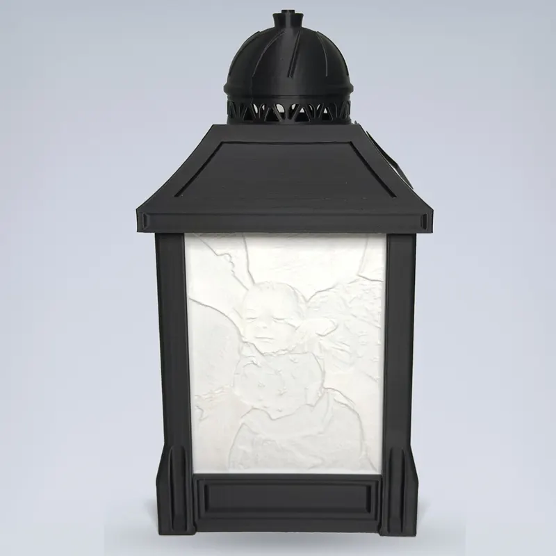 Custom lithophane photo lamp switched off: a sculpted white relief panel in a black lantern